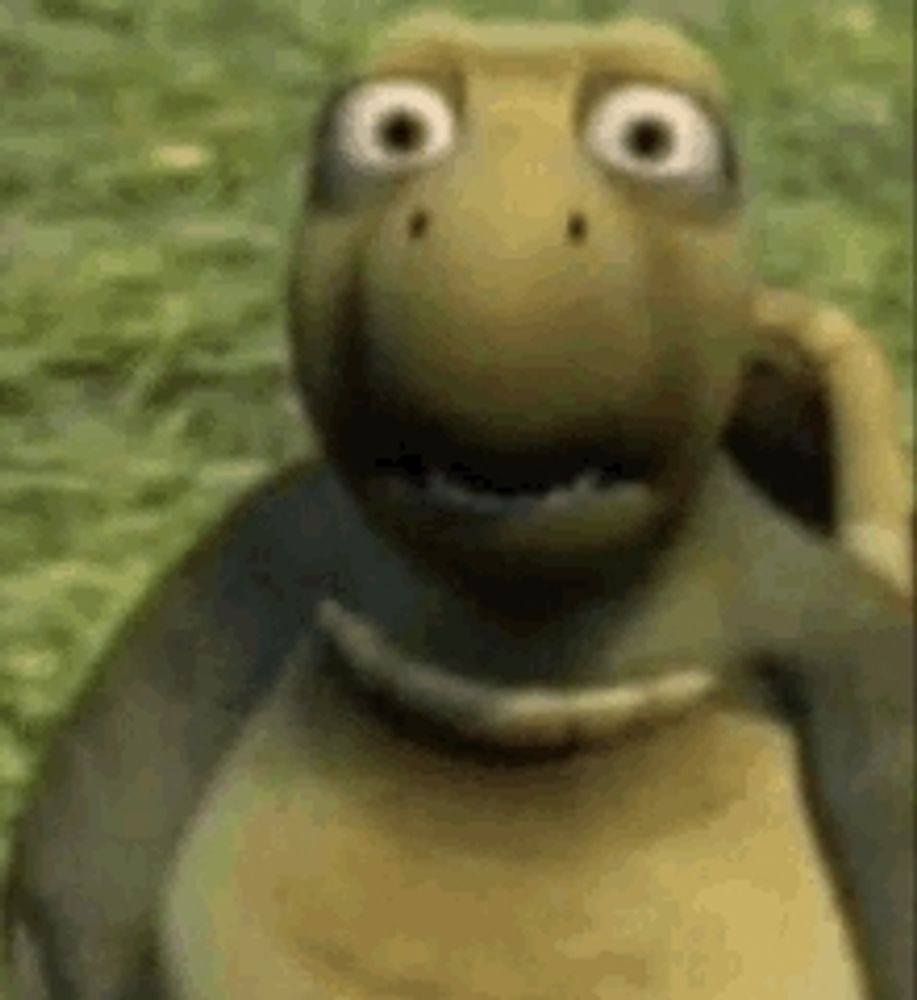 a cartoon turtle is standing in the grass and looking at the camera with a surprised look on its face .