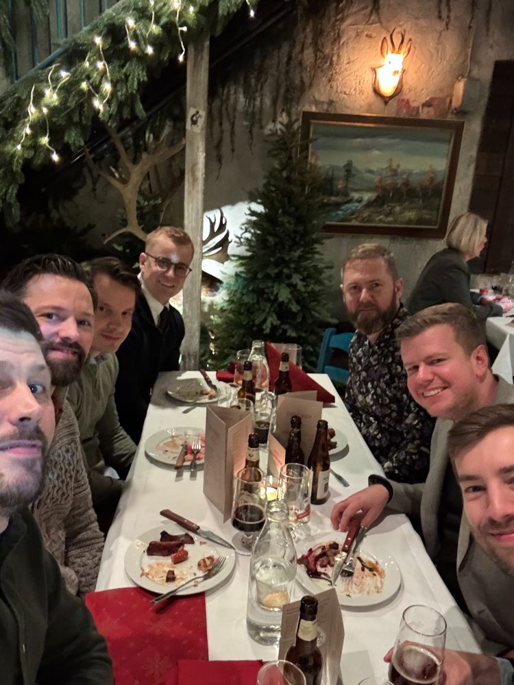 A group of cloud specialists enjoying a light Christmas dinner.