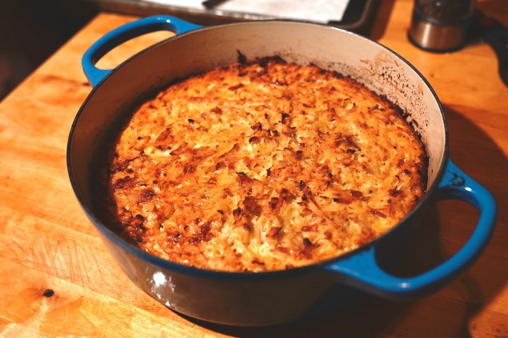 Kugelis cooked in a Dutch oven