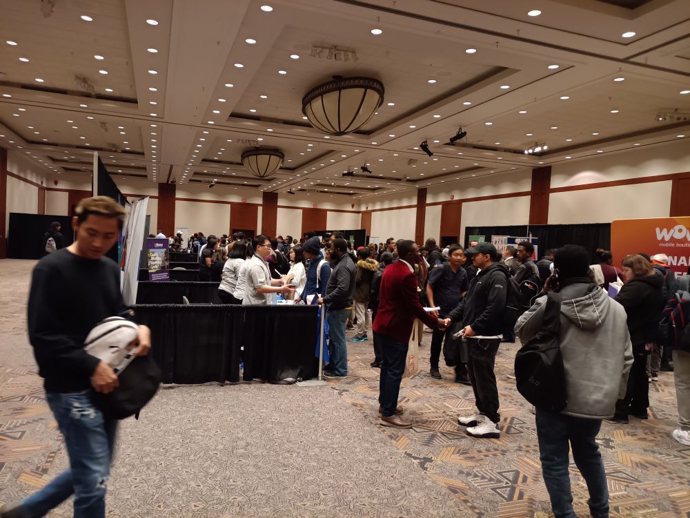It may look crowded, but there are only 18 exhibitors and only two of them are actually hiring. Maybe.

One's a retail store (WOW mobile), and the other is a property manager