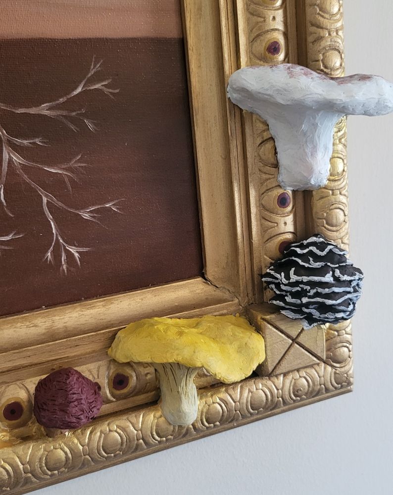 Sculpted mushrooms rising out of a gilded painting frame like little alien creatures. A tiny textured mushroom with a maroon cap. A bright yellow chanterelle that had not yet become lunch. A cluster of brown polypores with white edges that looks like a dead shellaced Christmas tree. One lone resinous polypore beautifully meaty in bright white with red markings spreading out on top. 