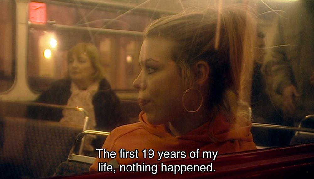 David Tennant episode. (Aren’t they all?) Rose Tyler is sitting on a London bus looking bored, eating some popcorn as people get on and sit down behind her. She looks out the window wistfully. Captions read, “The first 19 years of my life, nothing happened. Nothing at all.”