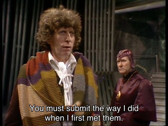 Tom Baker episode. (Aren’t they all?) The Doctor stands in a future Gallifreyan city, and you can tell, because the walls are all gray metal and have a bunch of pipes, with Borusa, a Time Lord wearing purple robes and a weird sort of helmet instead of the tall collars. The Doctor says, staring blankly into the middle distance, “You must submit the way I did when I first met them.”