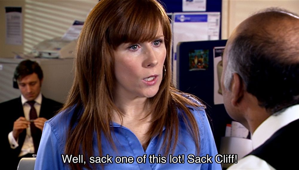 David Tennant episode. Donna is causing a scene in an office, arguing with her boss. A man is sitting behind her at a desk, futzing around with a pen, pretending very badly not to notice. Donna says, “Well, sack one of this lot! Sack Cliff! He just sits there. I don't know what he does all day. Sorry, Cliff.” She turns around to look at him, and he looks back at her like a sad puppy. “Actually, I'm not sorry. What do you do all day?”