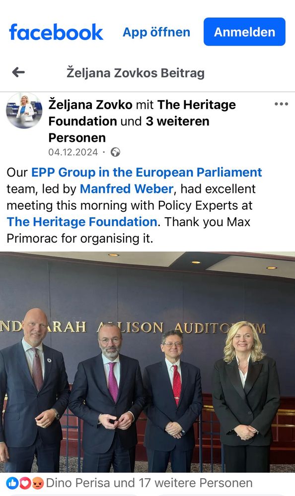 Screenshot Facebook Account
Foto 3 Männer und 1 blonde Frau mit halblangen Haaren. Bekleidet mit dunklen Anzügen bzw. Kostüm 

