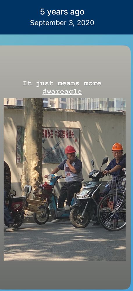 Construction worker in Shanghai with an Auburn Tigers jersey on 