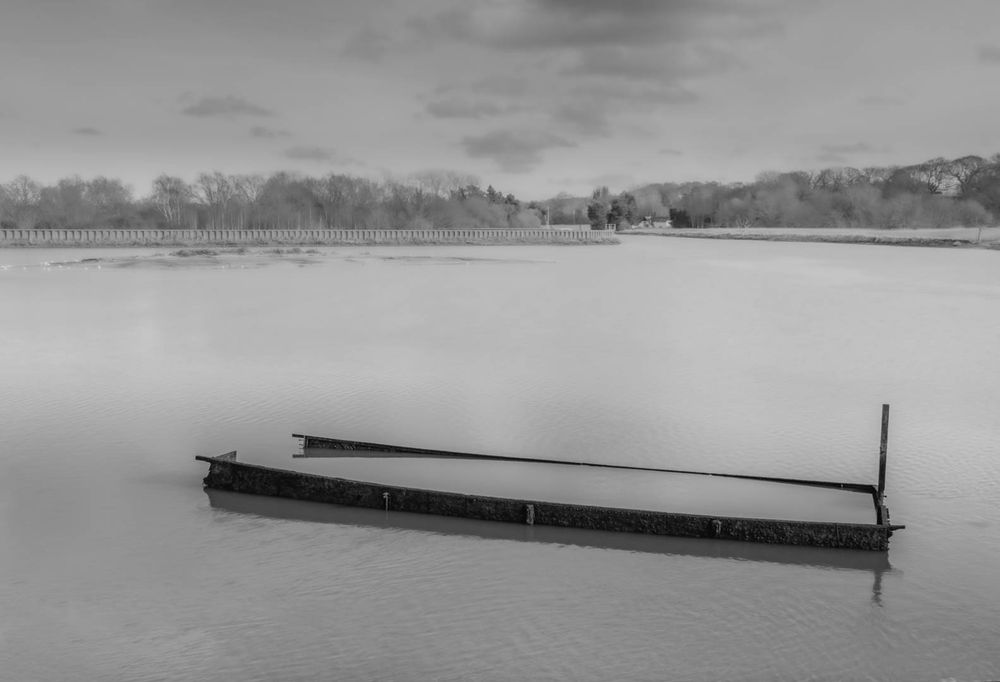 A boat struggling to rise above the water. Failing.