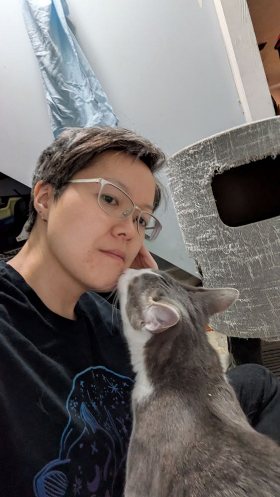 I'm sitting on the ground and I manage to take a selfie of me and him as he puts his front paws on my lap to lean up to lick rough-textured kisses onto my cheek. His tongue is exfoliating, and has the scent of Fancy Feast. Will it help my skin or make it break out? Time will tell (tomorrow)