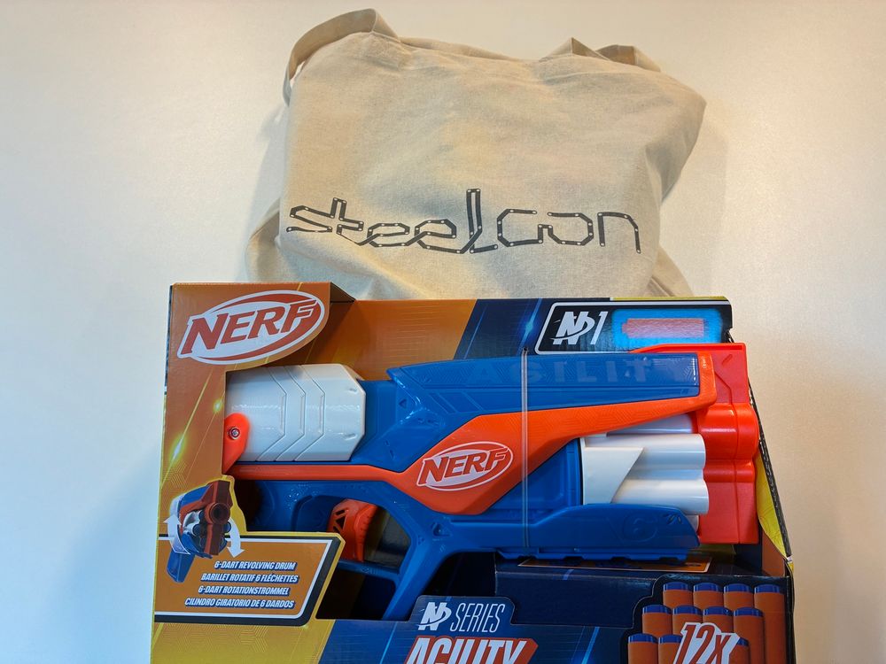 A nerf gun and steelcon swag bag