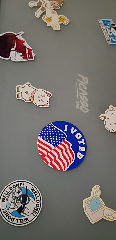 A picture of my drawing tablet with several stickers including an "I voted" sticker