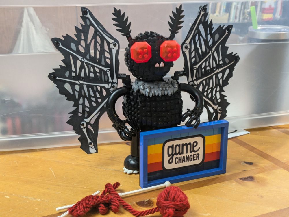 Lego recreations of Mothman and the Game Changer logo