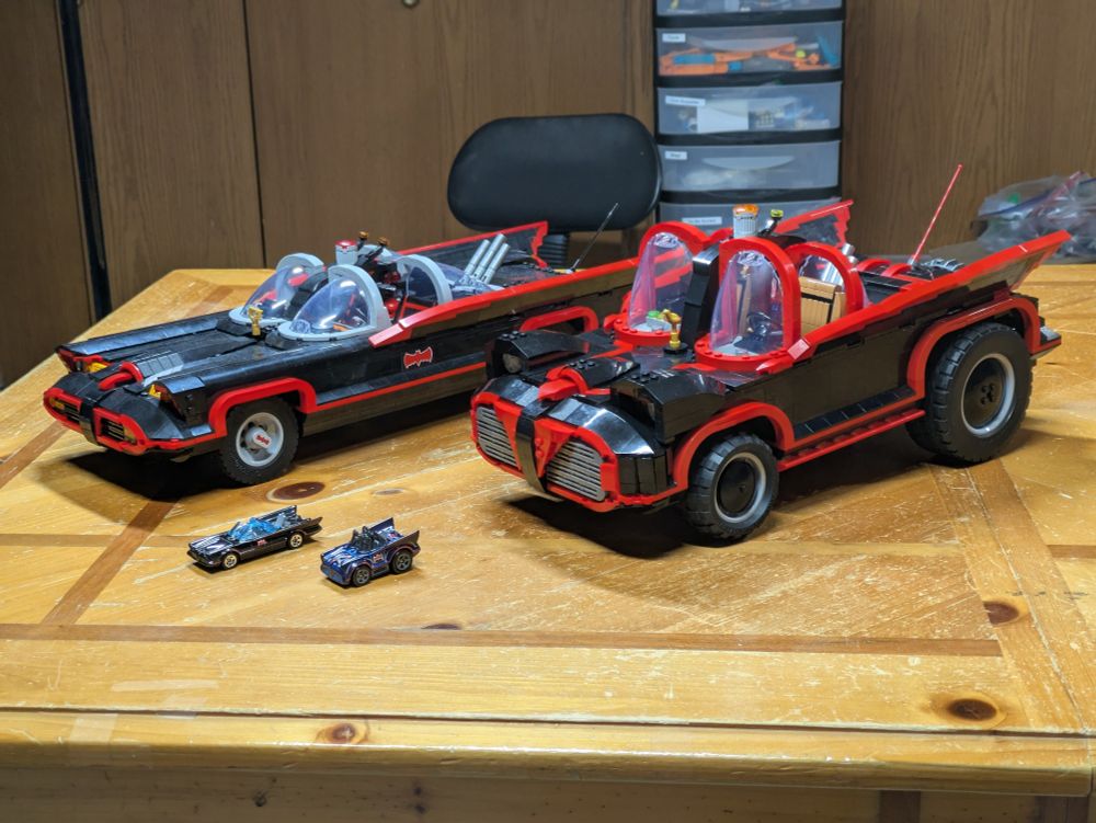 Two hot wheels Batmobiles, and two lego Batmobiles. 