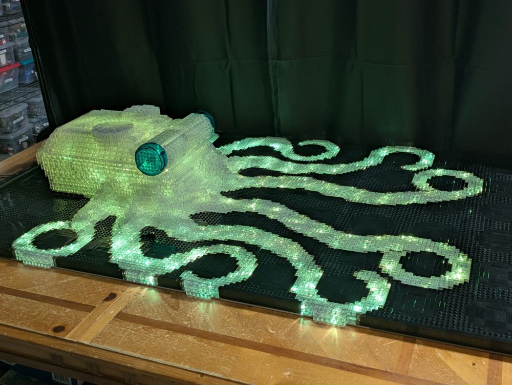 Lego octopus sculpture lit with greenish light