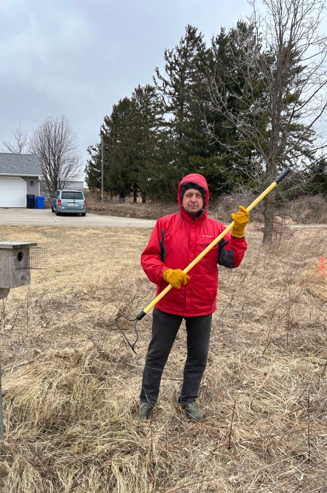 Man holding a rake