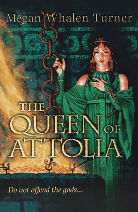 Book cover: The Queen of Attolia by Megan Whalen Turner. Illustration depicts a black-haired woman wearing a green, Grecian-style dress and jewellery standing in a dungeon beside a brazier.