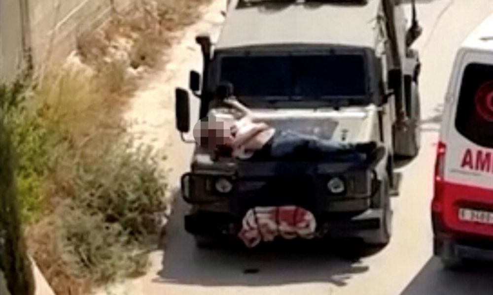 Israeli forces strap wounded Palestinian man to hood of military jeep