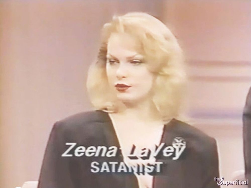 white woman with blond hair on a talk show set. chyron says “ZEENA LAVEY SATANIST” 