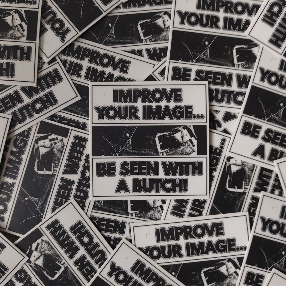 a black and white sticker that reads "improve your image... be seen with a butch!" between the text is a photo of a belt and jeans. 