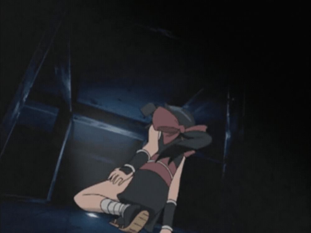 a girl in a black dress is standing in a dark hallway