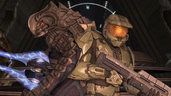 The Master Chief and the alien Arbiter back-to-back doing cool action movie bullshit.