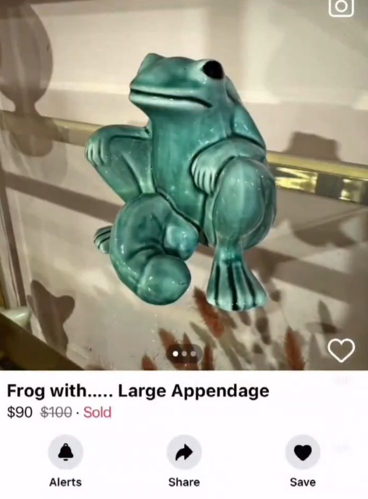 A frog with large appendage.