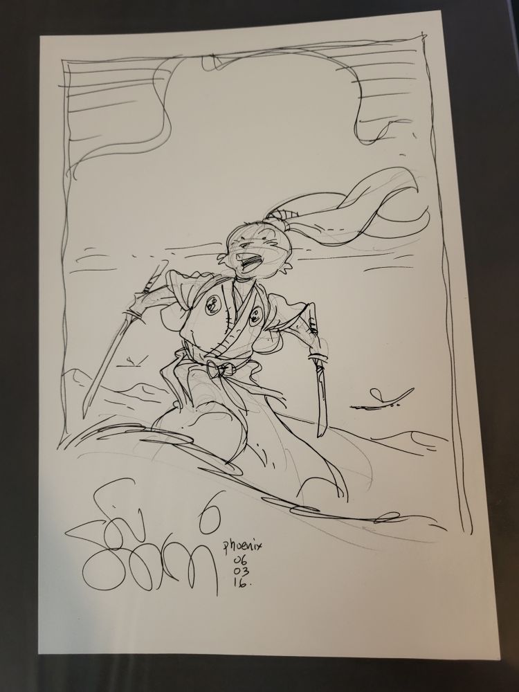 A sketch of Usagi Yojimbo, a rabbit samurai, holding two swords and dressed in flowing Japanese clothing on a grassy landscape