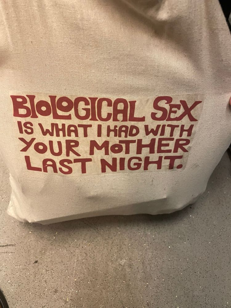 Tote bag that reads, biological sex is what I had with your mother last night. 