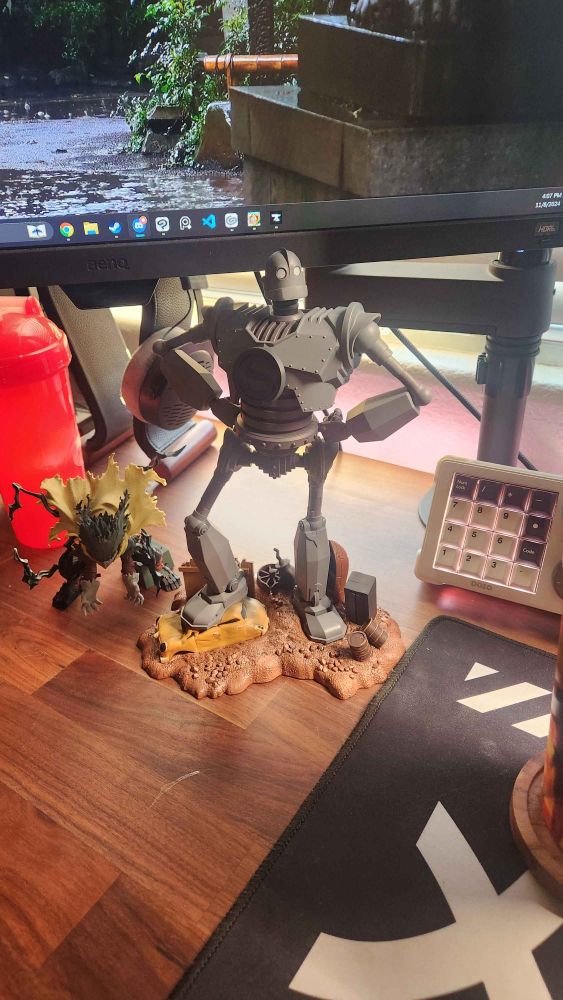 The character in the picture is The Iron Giant, from the movie "The Iron Giant" made by Warner Bro.