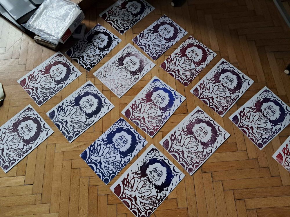 Liolcut prints of Viktor from Arcane spread on the ground drying after printing.