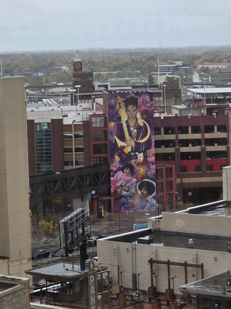 Mural of Prince in downtown Minneapolis seen from another building. 