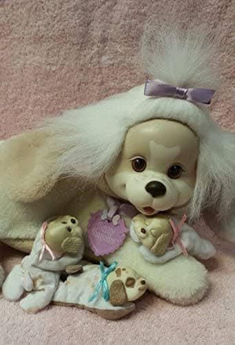 A toy plush dog called puppy surprise with three tiny baby puppies