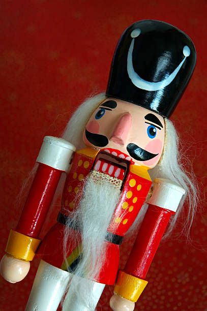 Nutcracker with mouth open, looking distressed