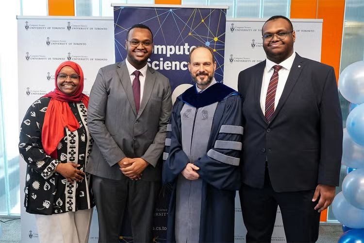The Alims are joined by Eyal de Lara, chair of the department of computer science, at a graduation reception