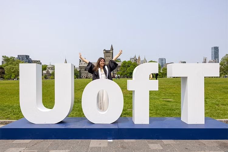 The giant “U of T” letters on Front Campus near Convocation Hall made it easy for this U of T Scarborough graduate to capture a special moment