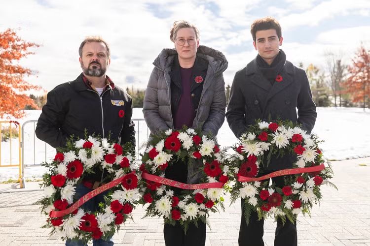 Alexandra Gillespie (centre), U of T vice-president and principal of U of T Mississauga, Richard Waters (left), representative of United Steelworkers Local 1998 and Faisal Halabeya (right), PhD student of physics and president of the U of T Mississauga Association of Graduate Students, laid wreaths at U of T Mississauga's Service of Remembrance