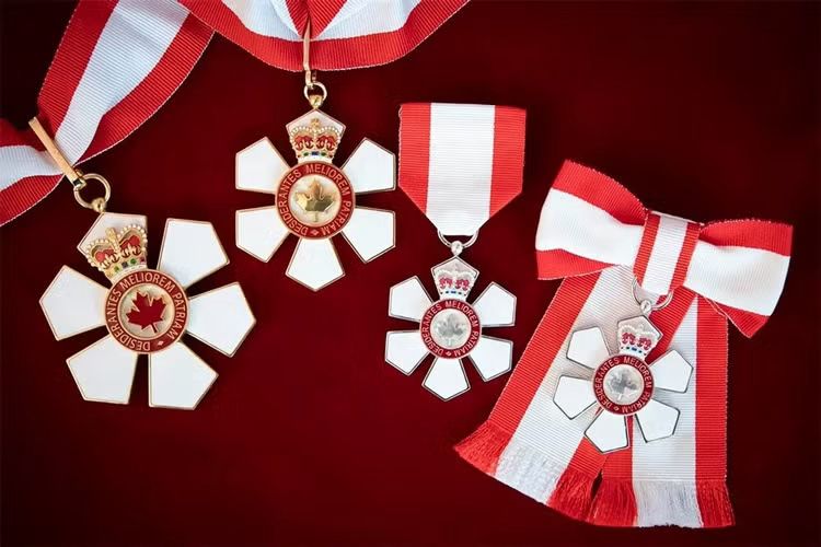 Image shows four Order of Canada medals