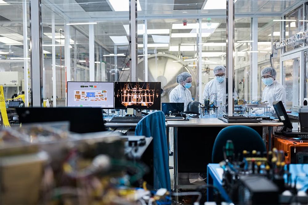 Three researchers working in a lab
