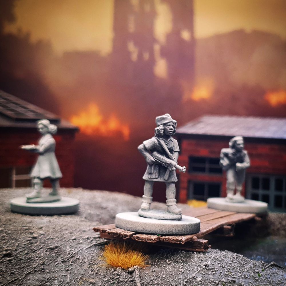 Three resistance figures, unpainted, in front of a fiery backdrop

Sculpted by Alan Marsh
Backdrop by Handiwork Games
Terrain by berlintuesday and warbases