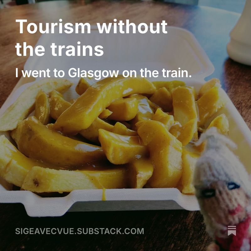 A photograph of a box of chips covered in curry sauce being observed by a ravenous Peruvian finger puppet serves as the background to the text "Tourism without the trains. I went to Glasgow on the train."
