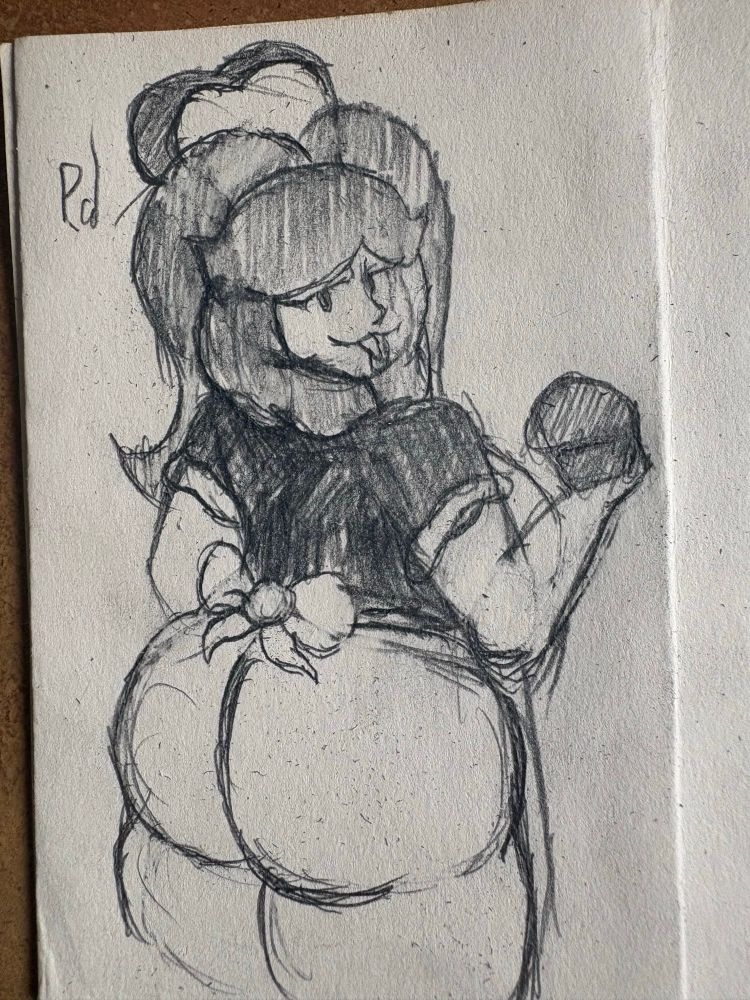 Breadna looking at the viewer, looks like she’s holding a muffin… and her buns are out…