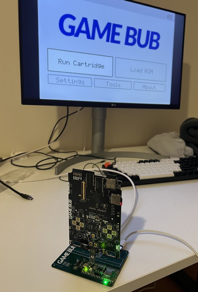 photo game bub console plugged into dock and connected to monitor