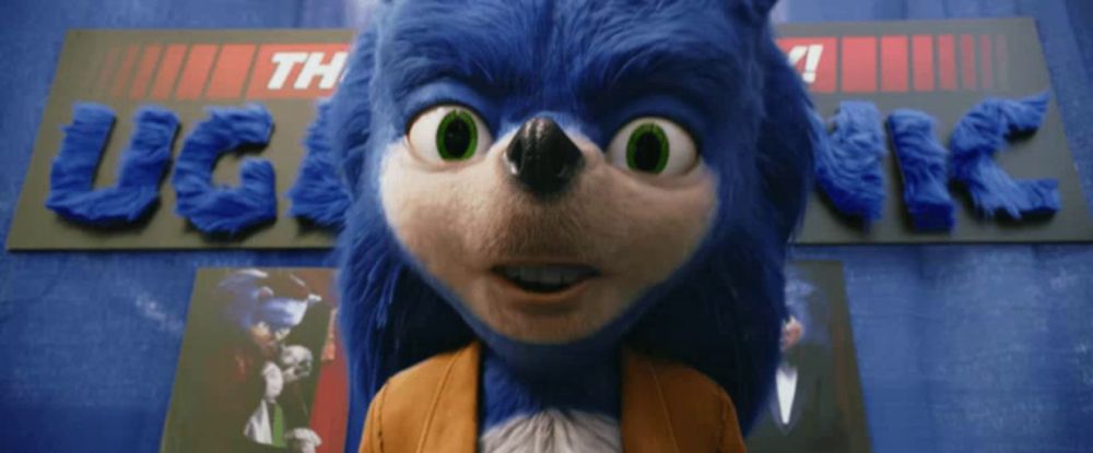 a sonic the hedgehog stands in front of a sign that says ugly sonic