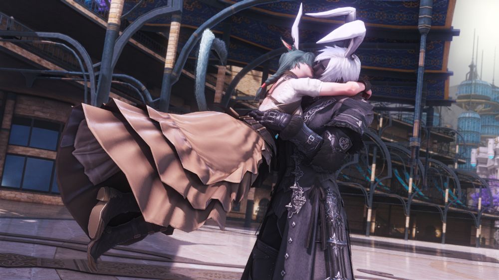 A dark complexioned roegadyn girl with white hair and bent bunny ears, wearing a dark cool grey edenmorn fending jacket and gloves, catching her pale, seafoam green haired miqo love in the air mid jump as their lips meet. The miqo is adorned in a coffee and cream colored, flowy neo-ishgardian outfit, boots hung in the air from her leap, matching white ears standing up stock straight, arms wrapped about the roes collar. The roe gently clasps her sides in turn, catching her with delicacy. Beyond them is the crystarium plaza midday, warm in temp with a slight tilt to the shot taken in the moment.