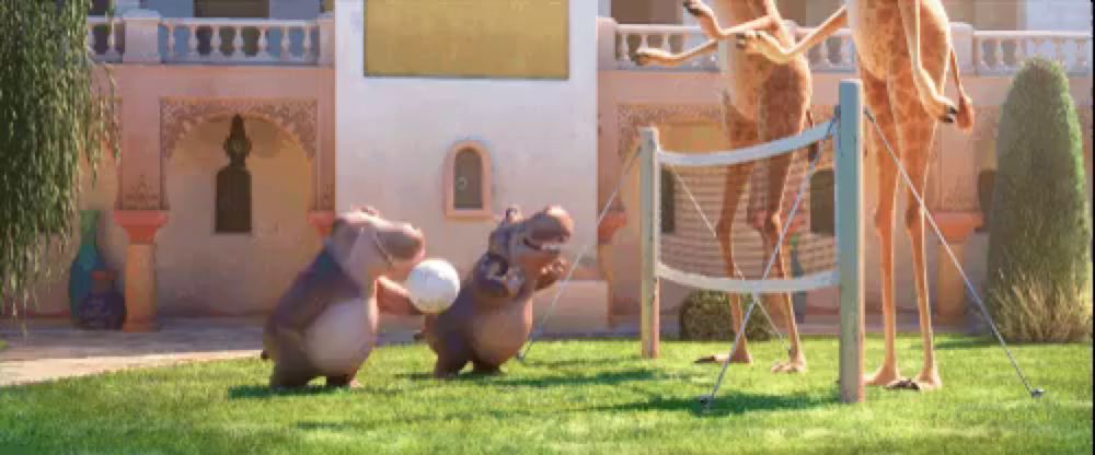 a group of animals are playing volleyball in a backyard