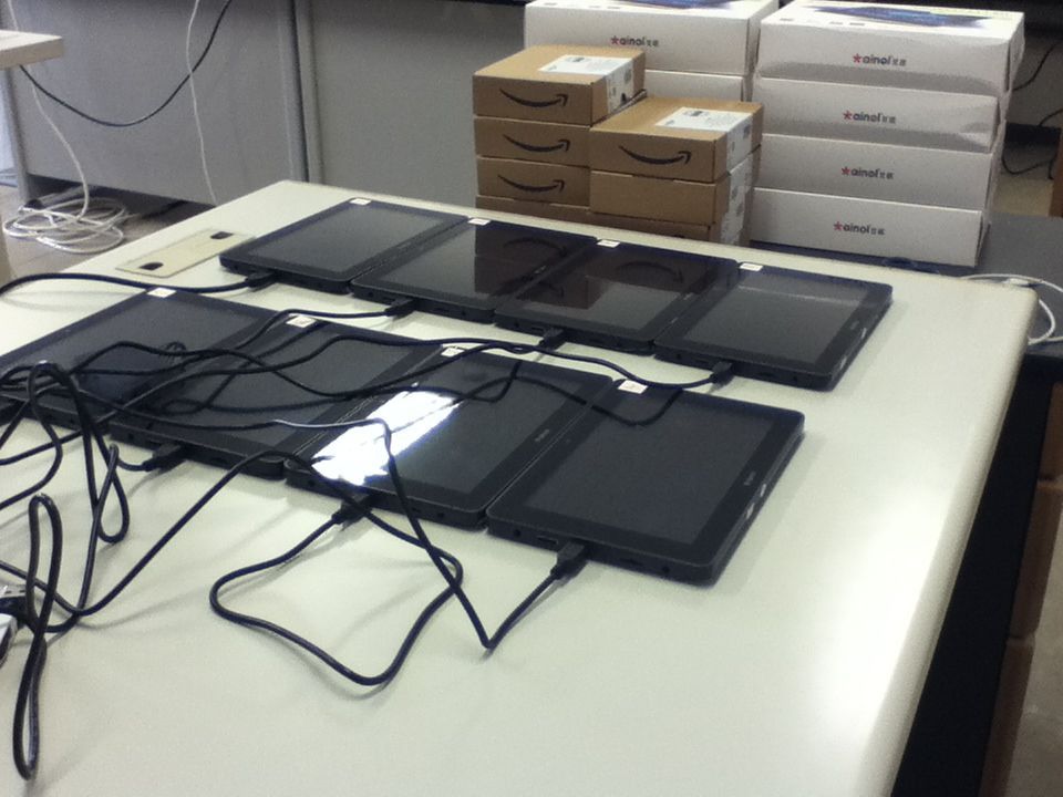 Eight Android tablet computers arranged next to each other.