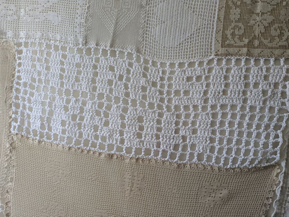 filet crochet in white that reads "work sux / I know"