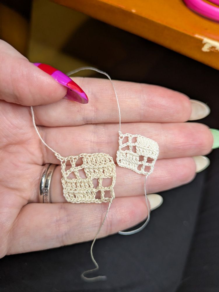 two small filet crochet swatches, one half the size of the other 