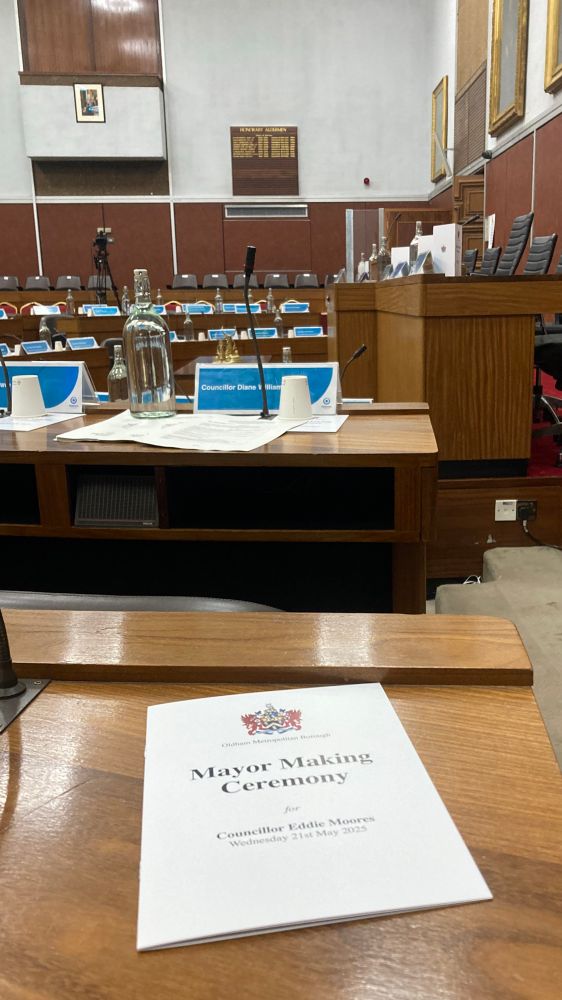 A programme saying “Mayor Making Ceremony” with the council chambers.
