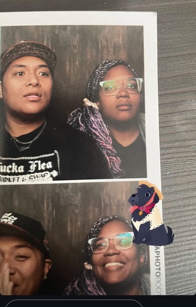 part of a photo booth photo of riva and aziza staring blankly then laughing about it