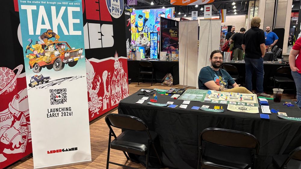 Senior Developer Nick Brachmann at the Leder Games booth, ready to talk you through Take!
